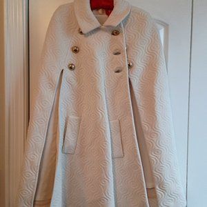 WHITE "EMBOSSED" SWING CAPE WITH FRONT POCKET